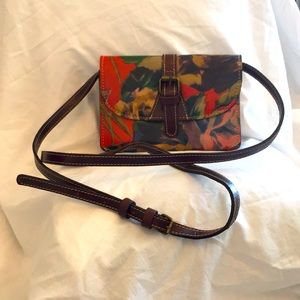 Small leather bag w/floral design by Patricia Nash